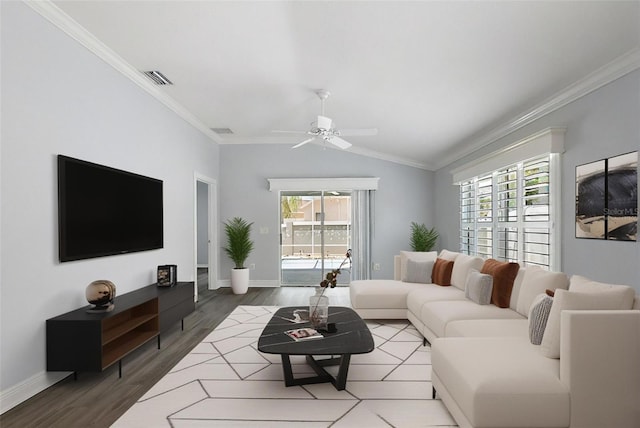 997 Oscar Ln, The Villages, FL 32162 - living room with ceiling fan, plenty of natural light, wood finished floors, ornamental molding, and lofted ceiling
