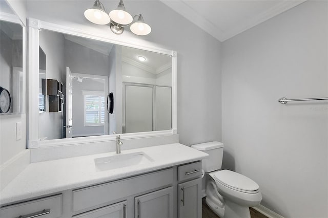 997 Oscar Ln, The Villages, FL 32162 - bathroom featuring vanity, toilet, a shower stall, and crown molding
