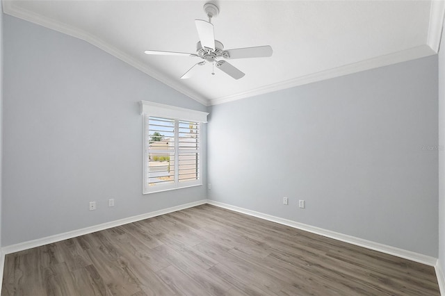 997 Oscar Ln, The Villages, FL 32162 - spare room featuring vaulted ceiling, wood finished floors, crown molding, a ceiling fan, and baseboards
