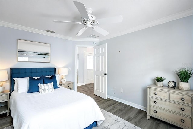 997 Oscar Ln, The Villages, FL 32162 - bedroom featuring ornamental molding, dark wood-type flooring, baseboards, and a ceiling fan