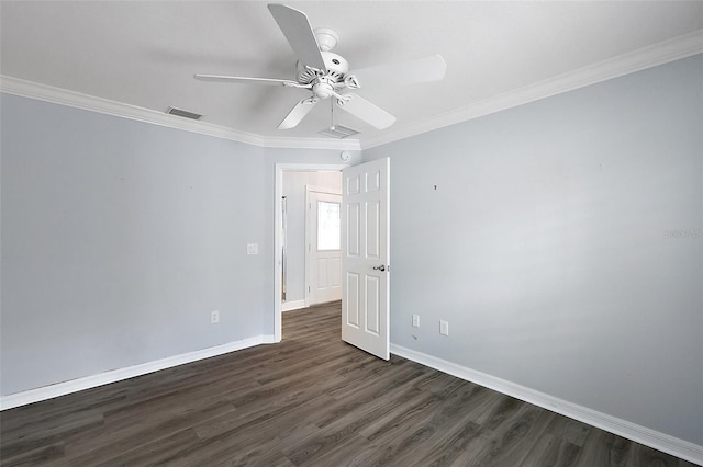 997 Oscar Ln, The Villages, FL 32162 - spare room with dark wood-style flooring, baseboards, ornamental molding, and ceiling fan