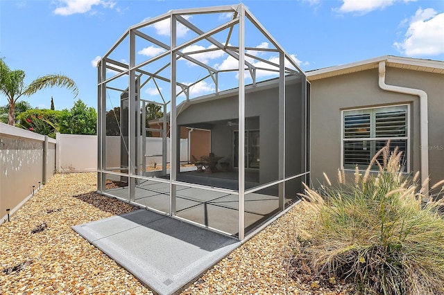 997 Oscar Ln, The Villages, FL 32162 - back of house featuring a fenced backyard, stucco siding, a patio, and a lanai