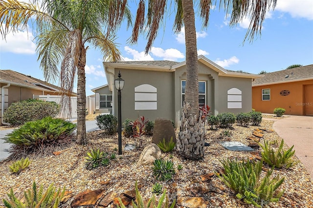 997 Oscar Ln, The Villages, FL 32162 - view of front of home featuring stucco siding