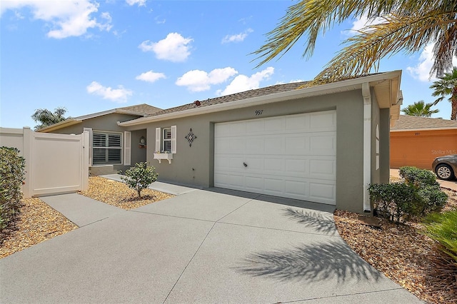 997 Oscar Ln, The Villages, FL 32162 - single story home with stucco siding, a garage, and driveway