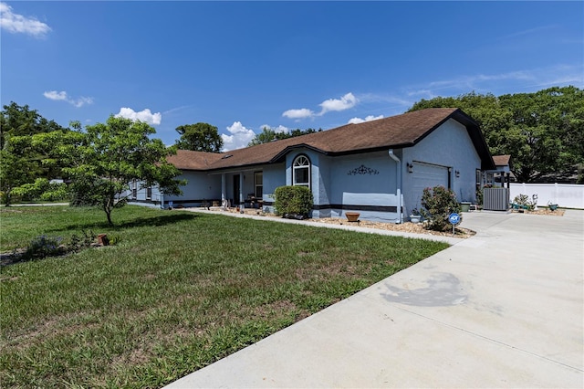 5521 Oak St, Mount Dora, FL 32757 - ranch-style house featuring an attached garage, stucco siding, central air condition unit, and driveway