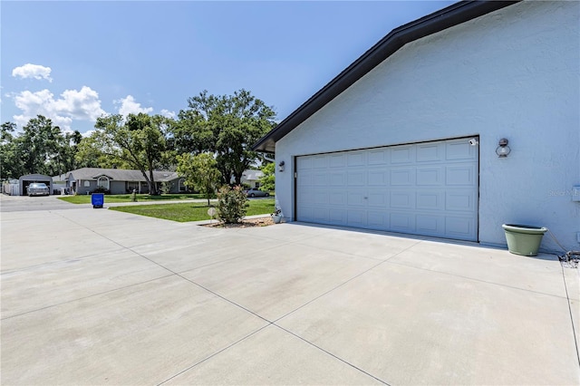5521 Oak St, Mount Dora, FL 32757 - garage featuring concrete driveway