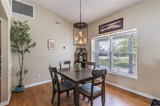 5521 Oak St, Mount Dora, FL 32757 - dining room with baseboards and wood finished floors