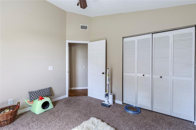 5521 Oak St, Mount Dora, FL 32757 - carpeted bedroom featuring a closet, baseboards, high vaulted ceiling, and a ceiling fan