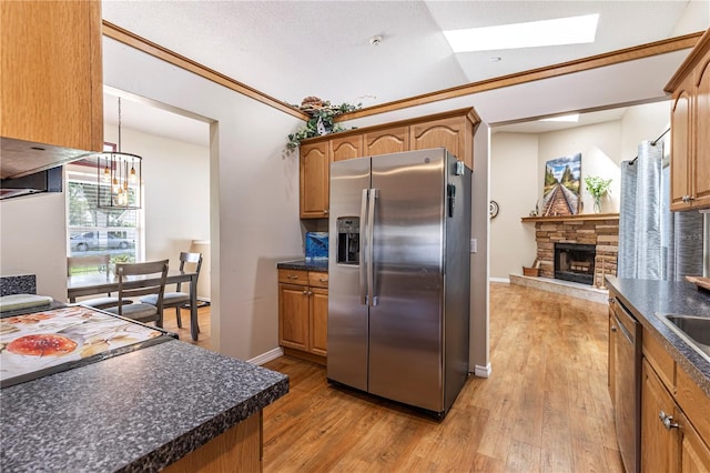 5521 Oak St, Mount Dora, FL 32757 - kitchen with appliances with stainless steel finishes, dark countertops, and light wood-type flooring