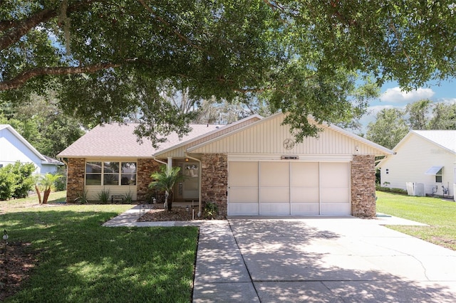 1011 Dundee Cir, Leesburg, FL 34788 - view of front of property with stone siding, concrete driveway, a front lawn, and a garage