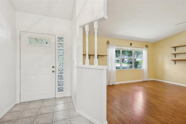 1011 Dundee Cir, Leesburg, FL 34788 - entrance foyer with baseboards and a textured ceiling
