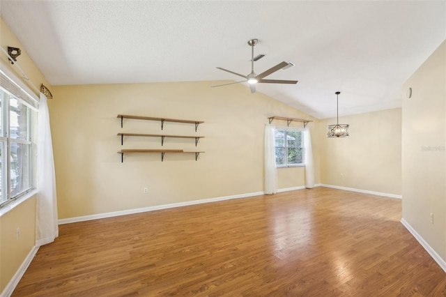 1011 Dundee Cir, Leesburg, FL 34788 - unfurnished room featuring ceiling fan, wood finished floors, lofted ceiling, and baseboards