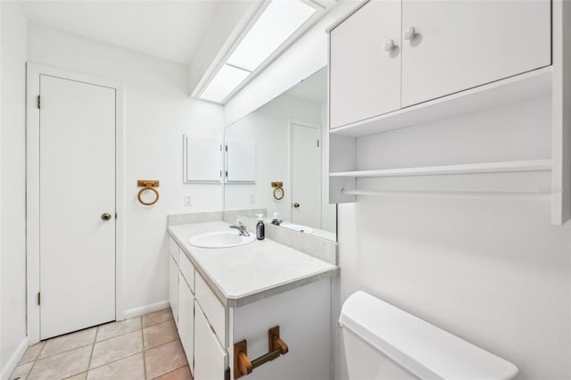 1011 Dundee Cir, Leesburg, FL 34788 - bathroom with vanity, toilet, tile patterned flooring, and baseboards