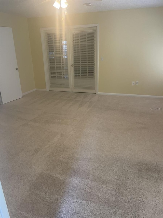 1011 Dundee Cir, Leesburg, FL 34788 - unfurnished room with light colored carpet and baseboards