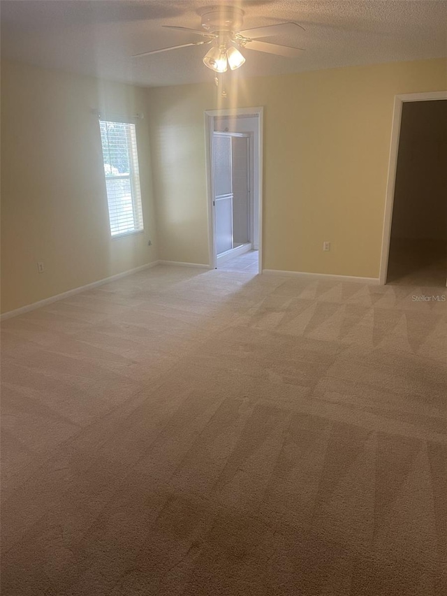 1011 Dundee Cir, Leesburg, FL 34788 - empty room with light carpet, ceiling fan, and baseboards