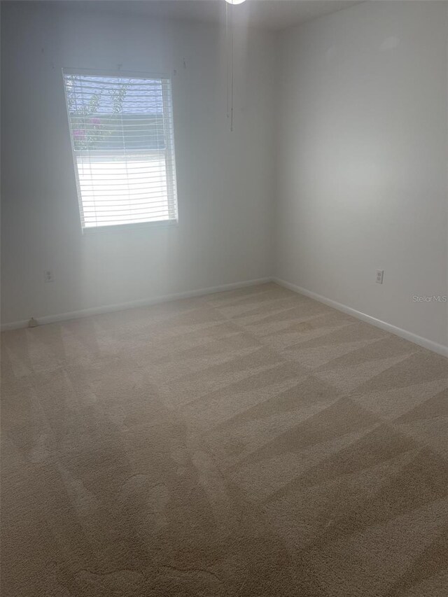1011 Dundee Cir, Leesburg, FL 34788 - spare room with light carpet and baseboards