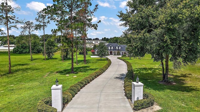 35449 Pinegate Trl, Eustis, FL 32736 - surrounding community with a lawn