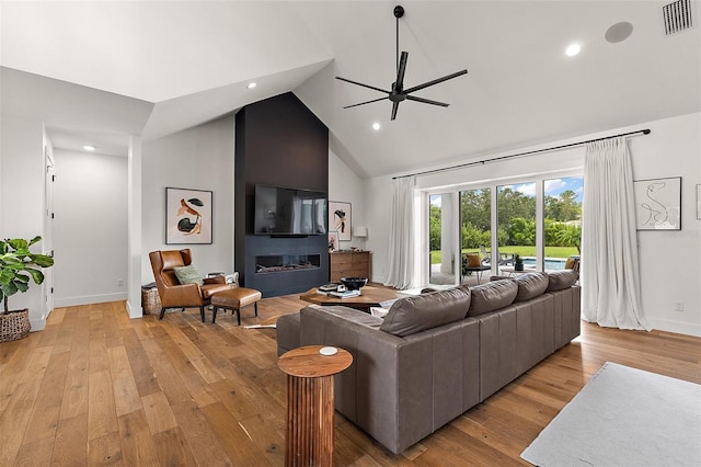 35449 Pinegate Trl, Eustis, FL 32736 - living area featuring ceiling fan, high vaulted ceiling, light wood-style flooring, recessed lighting, and a fireplace