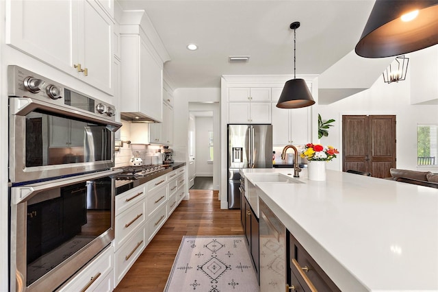 35449 Pinegate Trl, Eustis, FL 32736 - kitchen featuring stainless steel appliances, recessed lighting, dark wood-style flooring, white cabinets, and tasteful backsplash