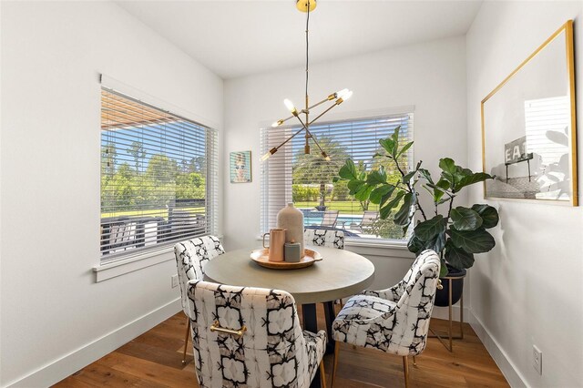 35449 Pinegate Trl, Eustis, FL 32736 - dining room featuring a chandelier and wood finished floors