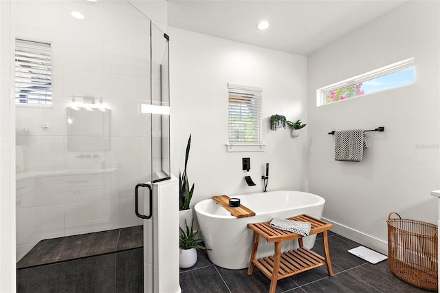 35449 Pinegate Trl, Eustis, FL 32736 - full bath featuring a shower stall, a freestanding bath, and recessed lighting