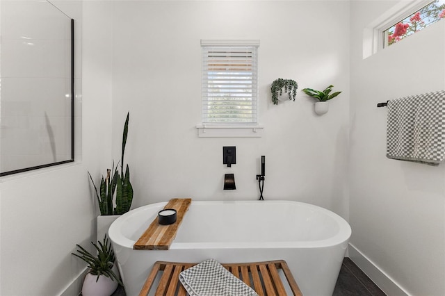 35449 Pinegate Trl, Eustis, FL 32736 - bathroom with healthy amount of natural light and a soaking tub