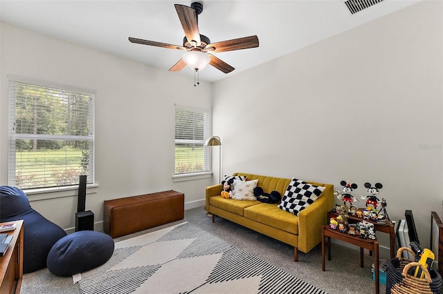 35449 Pinegate Trl, Eustis, FL 32736 - living area featuring healthy amount of natural light, carpet flooring, and a ceiling fan