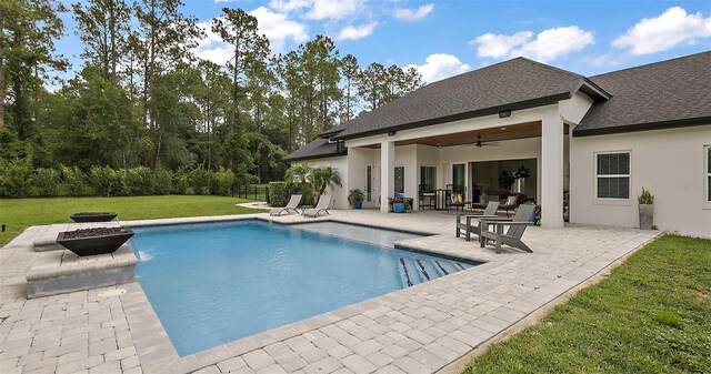 35449 Pinegate Trl, Eustis, FL 32736 - outdoor pool featuring a patio area, an outdoor fire pit, and ceiling fan