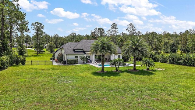 35449 Pinegate Trl, Eustis, FL 32736 - back of house featuring a patio area and stucco siding