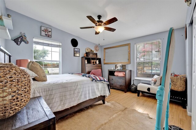 21320 Paradise Way, Eustis, FL 32736 - bedroom with wood finished floors and ceiling fan