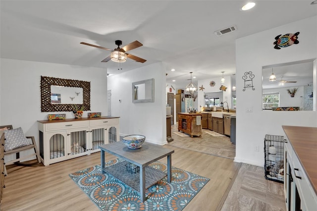 21320 Paradise Way, Eustis, FL 32736 - living area with a ceiling fan, baseboards, light wood-type flooring, and recessed lighting