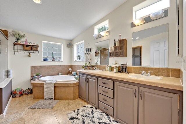 21320 Paradise Way, Eustis, FL 32736 - full bathroom with double vanity, a garden tub, tile patterned floors, and a shower
