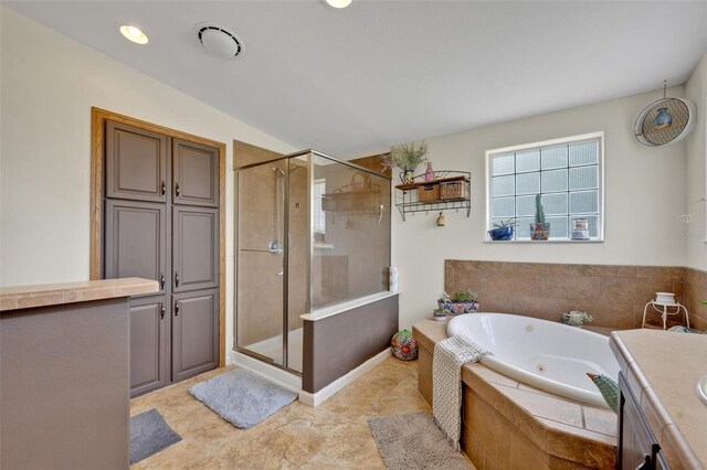 21320 Paradise Way, Eustis, FL 32736 - bathroom with a whirlpool tub, a stall shower, and vanity