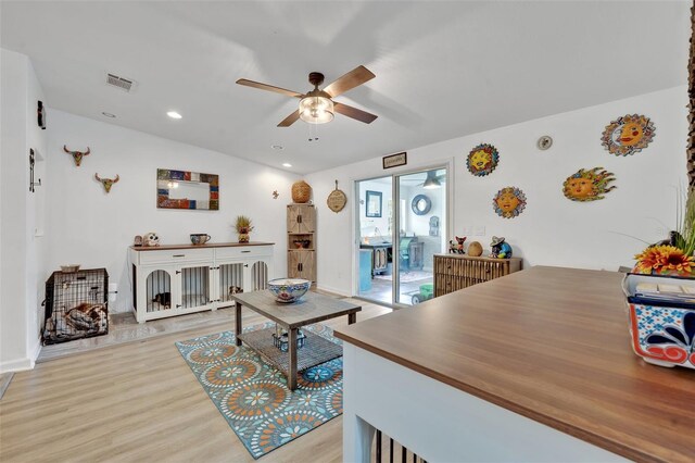21320 Paradise Way, Eustis, FL 32736 - living area with ceiling fan, light wood finished floors, recessed lighting, and baseboards