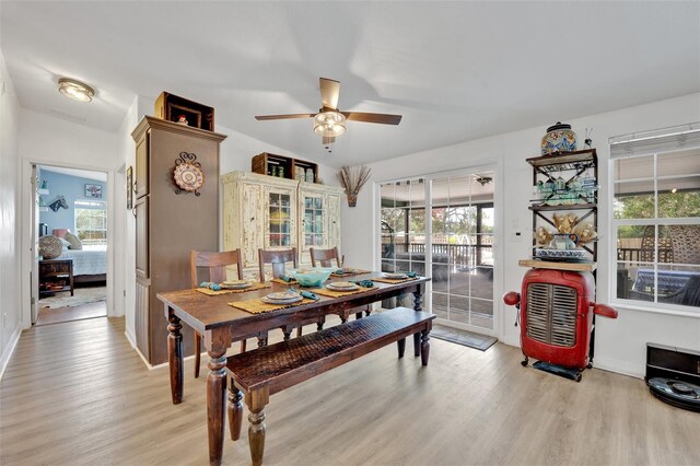 21320 Paradise Way, Eustis, FL 32736 - dining area with light wood-style flooring, ceiling fan, plenty of natural light, and baseboards