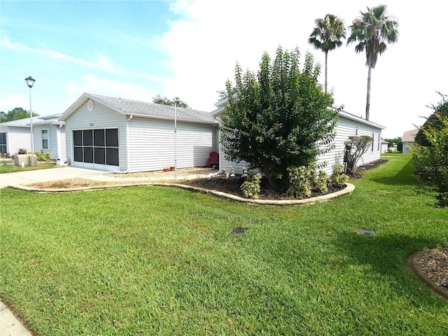 751 Old Oaks Ln, Leesburg, FL 34748 - view of property exterior with a garage, a yard, and driveway