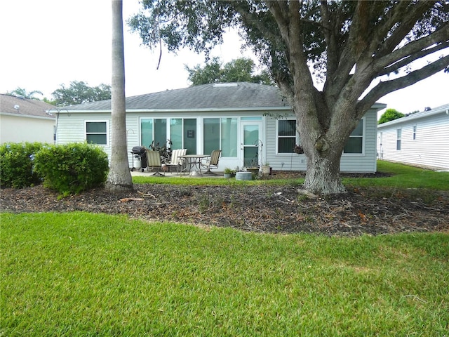751 Old Oaks Ln, Leesburg, FL 34748 - back of house with a lawn and a patio area