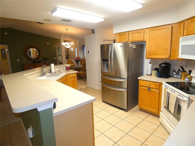 751 Old Oaks Ln, Leesburg, FL 34748 - kitchen with white appliances, a sink, a chandelier, light countertops, and light tile patterned floors