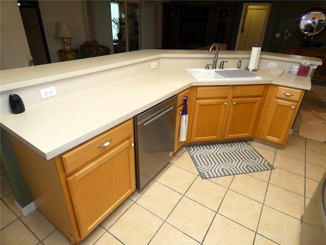 751 Old Oaks Ln, Leesburg, FL 34748 - kitchen featuring dishwasher, a sink, light countertops, and light tile patterned floors