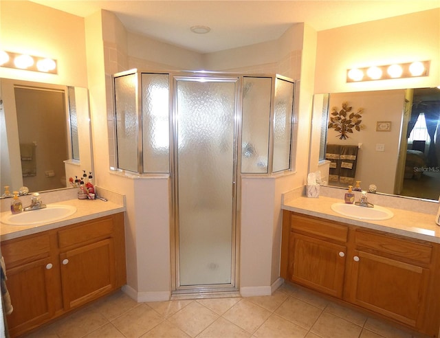 751 Old Oaks Ln, Leesburg, FL 34748 - bathroom featuring tile patterned floors, a stall shower, and two vanities