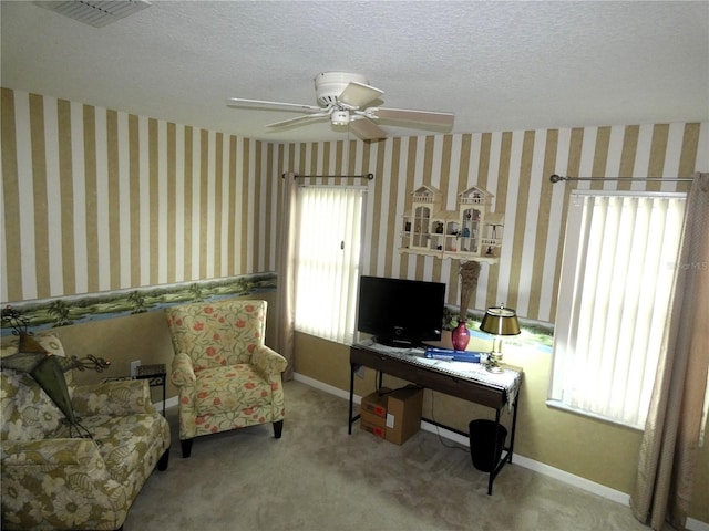 751 Old Oaks Ln, Leesburg, FL 34748 - office featuring a textured ceiling, ceiling fan, carpet flooring, and baseboards