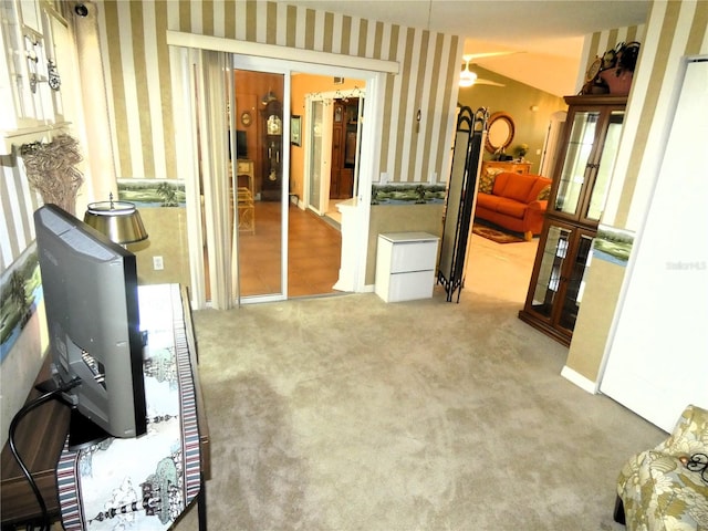 751 Old Oaks Ln, Leesburg, FL 34748 - hallway with wallpapered walls, french doors, and carpet floors