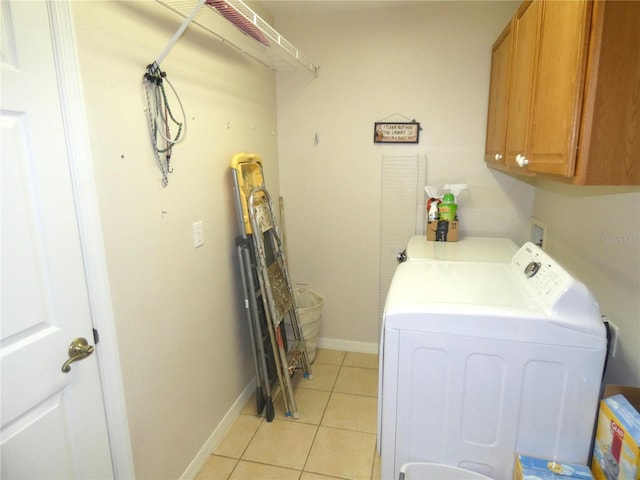 751 Old Oaks Ln, Leesburg, FL 34748 - laundry area featuring cabinet space, separate washer and dryer, light tile patterned flooring, and baseboards