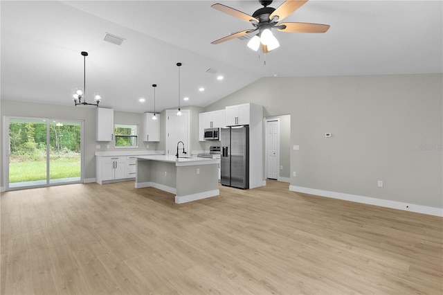 1115 W Geneva Pl, Citrus Springs, FL 34434 - kitchen featuring appliances with stainless steel finishes, a sink, open floor plan, light countertops, and lofted ceiling
