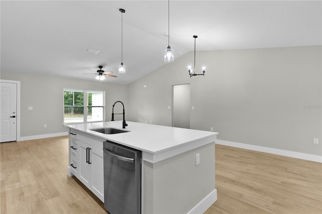 1115 W Geneva Pl, Citrus Springs, FL 34434 - kitchen with stainless steel dishwasher, a sink, light wood-style flooring, vaulted ceiling, and ceiling fan