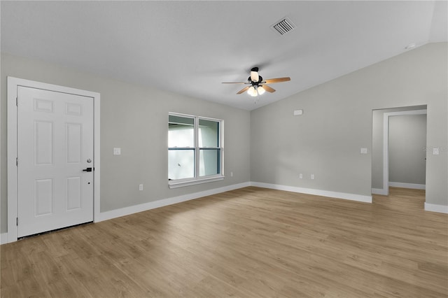 1115 W Geneva Pl, Citrus Springs, FL 34434 - unfurnished living room featuring ceiling fan, vaulted ceiling, light wood finished floors, and baseboards