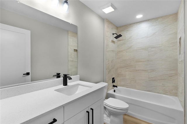 1115 W Geneva Pl, Citrus Springs, FL 34434 - bathroom with vanity, toilet, washtub / shower combination, and wood finished floors