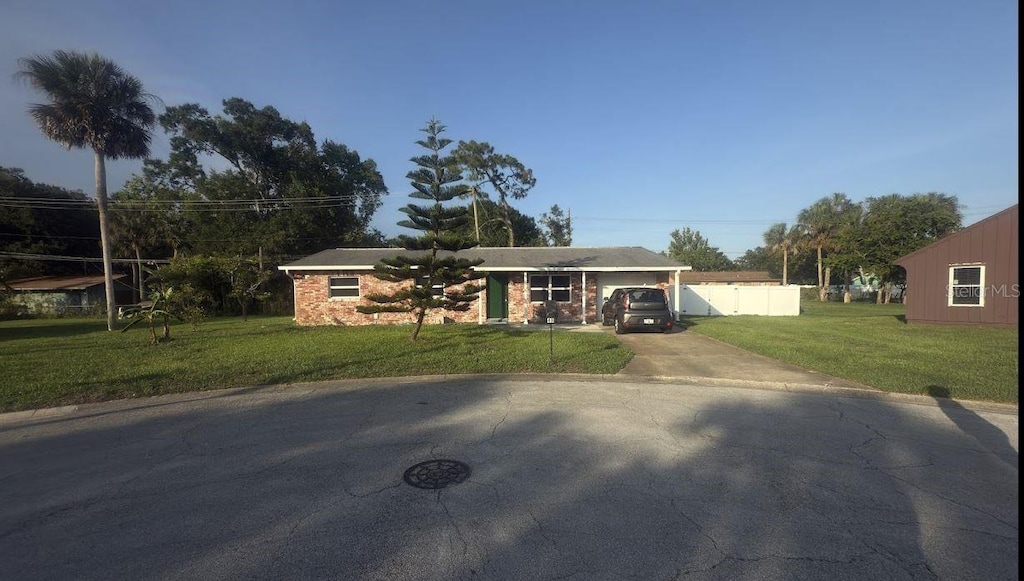 48 Pinehurst Cir, Ormond Beach, FL 32174 - single story home with driveway and brick siding