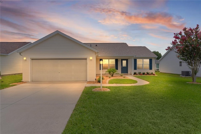 1313 Arredondo Dr, The Villages, FL 32162 - view of front facade with concrete driveway, an attached garage, central air condition unit, and a front lawn