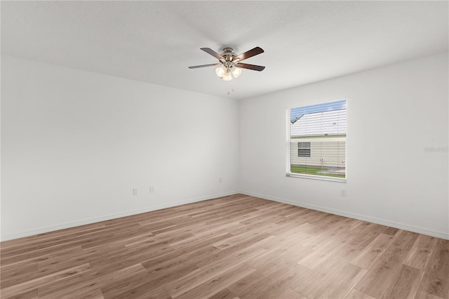 1313 Arredondo Dr, The Villages, FL 32162 - unfurnished room with light wood-type flooring, ceiling fan, and baseboards